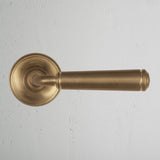 Antique Brass Digby Fixed Door Handle On White Background
